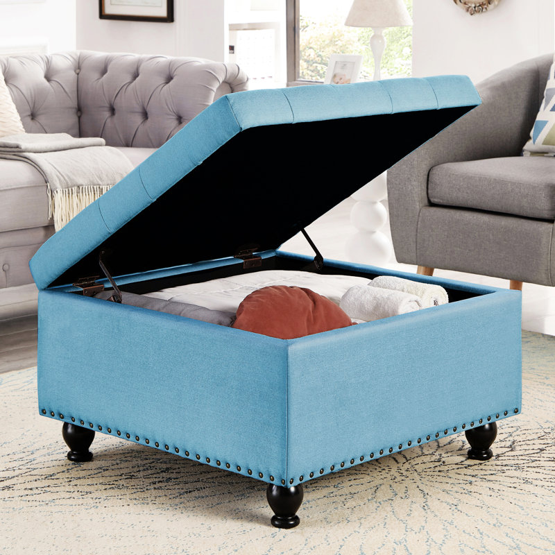 Rangement bleu avec capitonnage et pieds rembourrés