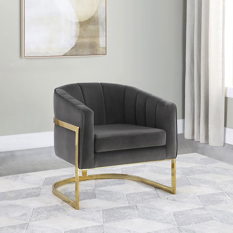 Fauteuil demi-tonneau capitonné gris foncé et doré