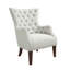 Fauteuil à oreilles capitonné