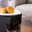 Table basse ronde à deux couches avec plateau en verre transparent et pieds noirs, option polyvalente pour la maison