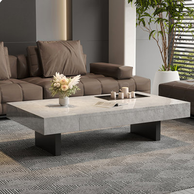 Simple rectangular rock slab floating coffee table