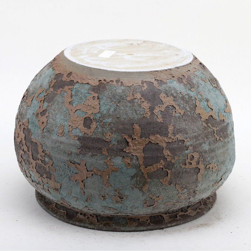 Poterie ronde en porcelaine émaillée