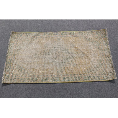 Tapis de porte rétro dans des tons de terre subtils avec un motif oriental de style bohème beige et vert olive