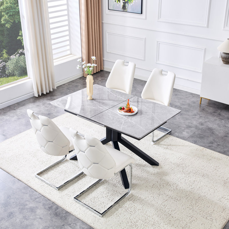 Table de salle à manger contemporaine en bois aggloméré extensible et 4 chaises à dossier en similicuir, parfaites pour les réunions de famille modernes et peu encombrantes