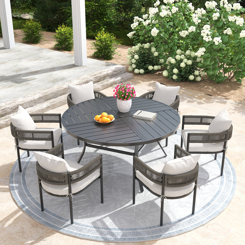 Ensemble de salle à manger d'extérieur avec table ronde de 60 po et 6 chaises rembourrées Pimarella, Black/Beige