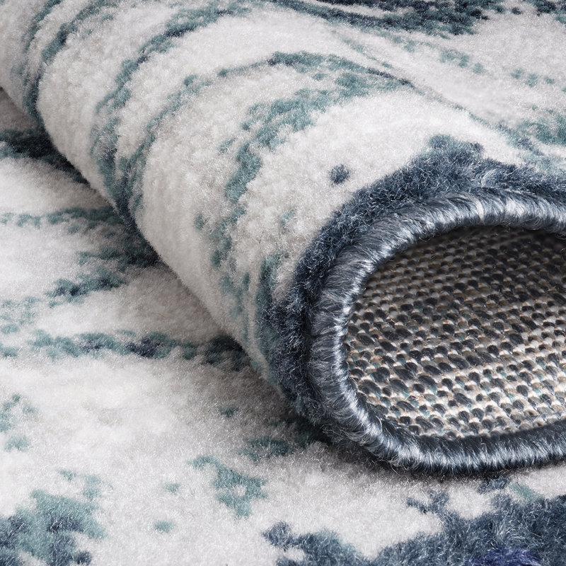 Tapis bleu tissé à la machine Kaylin
