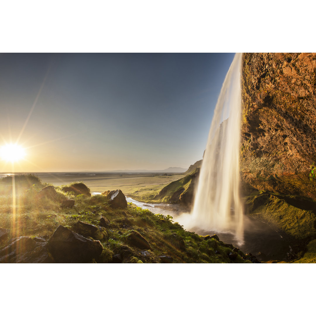 Sonne über dem Wasserfall Seljalandsfoss - Leinwandbild