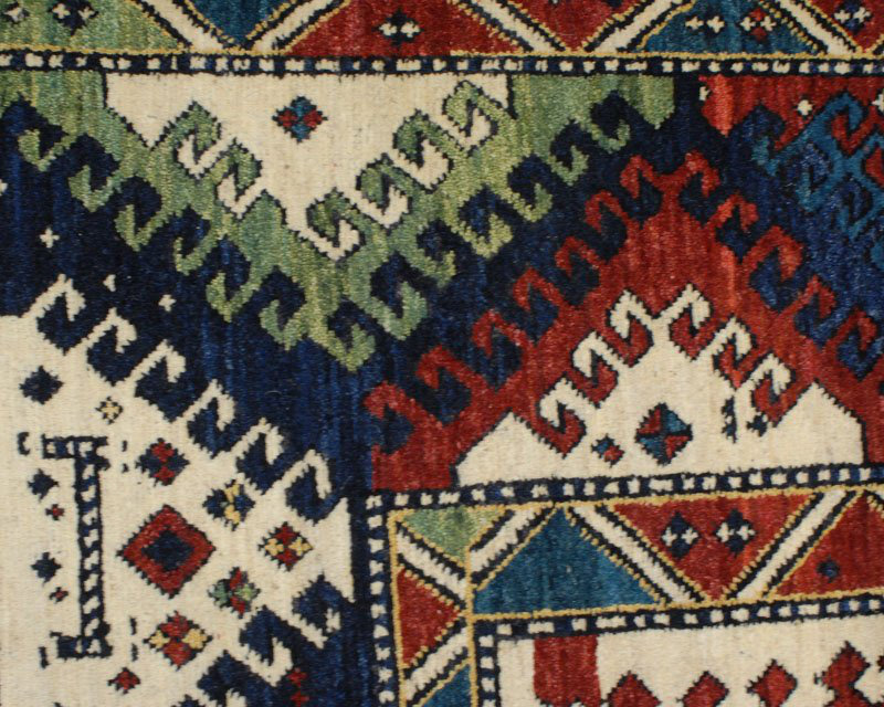 Bordjalu Wool Southwestern Area Rug in Green/Red