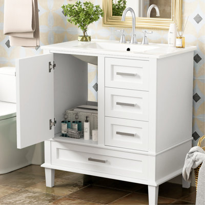 Meuble-lavabo de salle de bain blanc 30 po - Fabrication moderne en bois massif. Comprend un lavabo, 3 tiroirs et une porte à fermeture en douceur pour une structure soignée. Rangement équipé