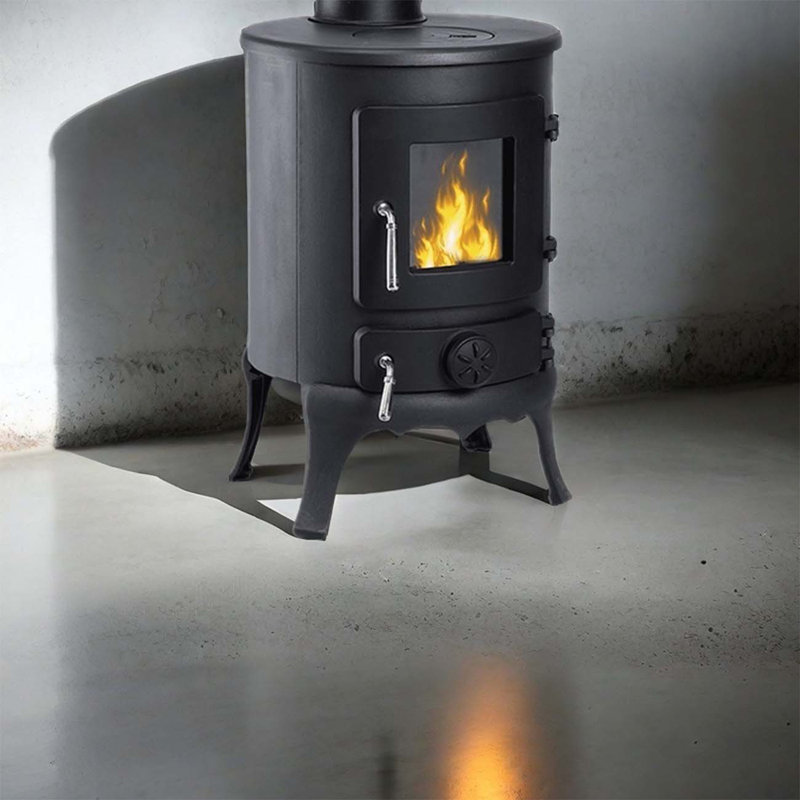 Small cylindrical cast iron wood-burning fireplace