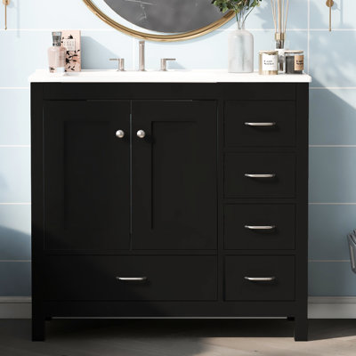 Meuble-lavabo noir avec lavabo en céramique, 36 po. Armoire de rangement abondante: 2 portes, 5 tiroirs. L 36 po x P 18 po x H 33,9 po. Bois massif et matériau. Poignées élégantes et élégantes en argent. Comptoir pratique