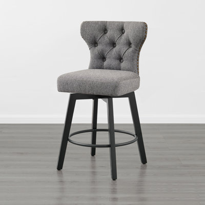 Tabouret de comptoir pivotant et capitonné