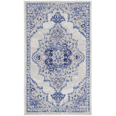 Tapis ivoire / bleu en polypropylène tissé à la machine Ikat