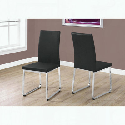 Ensemble de 2 chaises de salle à manger - aspect cuir noir - base en métal chromé
