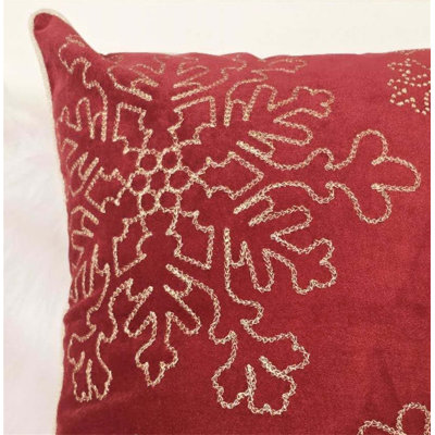 Coussin Holiday avec flocons de neige brodés dorés, insert en peluche et fermeture à glissière cachée pour un décor festif et confortable