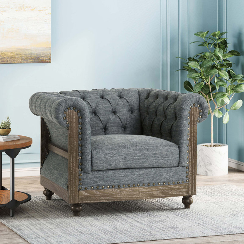 Fauteuil club capitonné