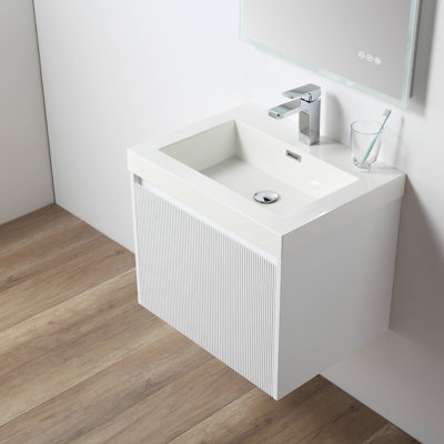 Meuble-lavabo flottant avec lavabo mural en bois avec dessus en acrylique, façade cannelée, porte à fermeture en douceur et rangement moderne Luziano