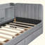 Lit de jour rembourré avec tiroirs, tablettes, armoires rabattables et table d'appoint