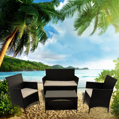 Bostwick 4 - Person Wicker Patio Dining Set with Extendable Rectangular Table , Cushions Included