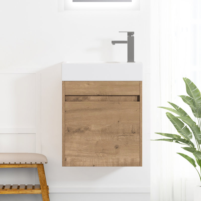 Meuble-lavabo mural de 18 pouces avec lavabo en résine et porte à fermeture douce, style moderne et fonctionnel, imitation chêne, grand espace de rangement.