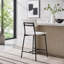 Tabouret de comptoir moderne en bois et métal avec siège en forme de selle