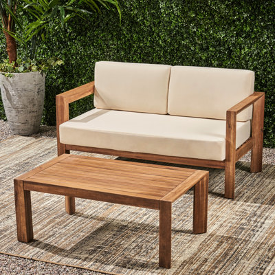Table basse en bois beige et brun avec table à lattes et coussins à dossier ouvert confortable, coussins d'eau, sièges élégants,