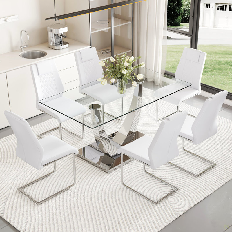 Ensemble de table et de chaises. Table de salle à manger moderne, plateau de table en verre trempé et pieds de couleur argenté.