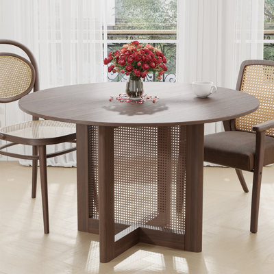 Table de salle à manger ronde en bois massif avec piédestal en rotin