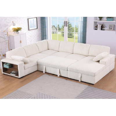 Canapé-lit modulaire avec lit escamotable, accoudoirs de rangement, méridienne de rangement orientée vers la droite