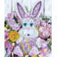 Lapin de Pâques avec couronne de printemps aux œufs