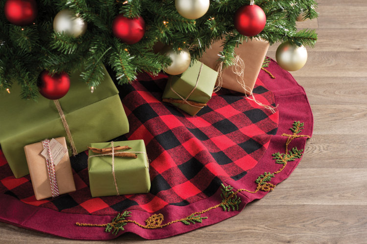 christmas skirt with christmas gifts placed on it
