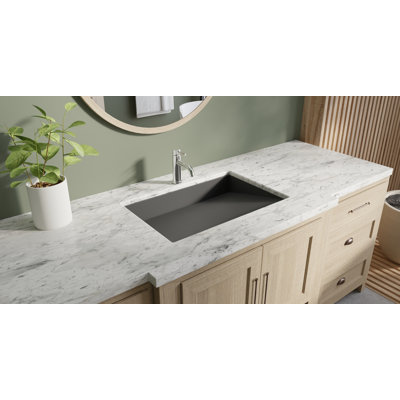 Lavabo de salle de bain encastré en pierre noire encastré en résine de 25,2 po x 16,1 po Badeloft UB-04-L-MBLK