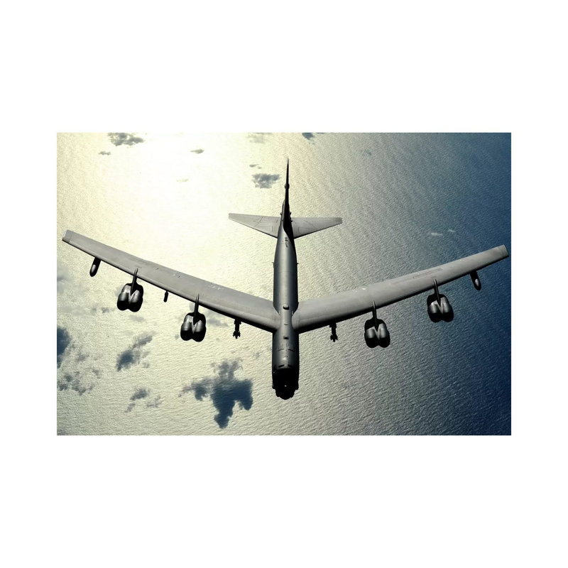 A B-52 Stratofortress In Flight Over The Pacific Ocean by Stocktrek Images - Wrapped Canvas Print