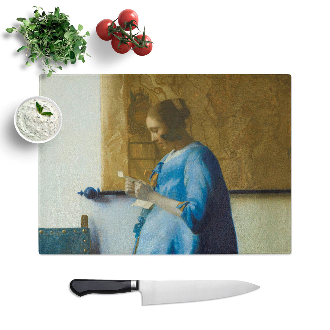 Woman Reading a Letter by Johannes Vermeer Chopping Board