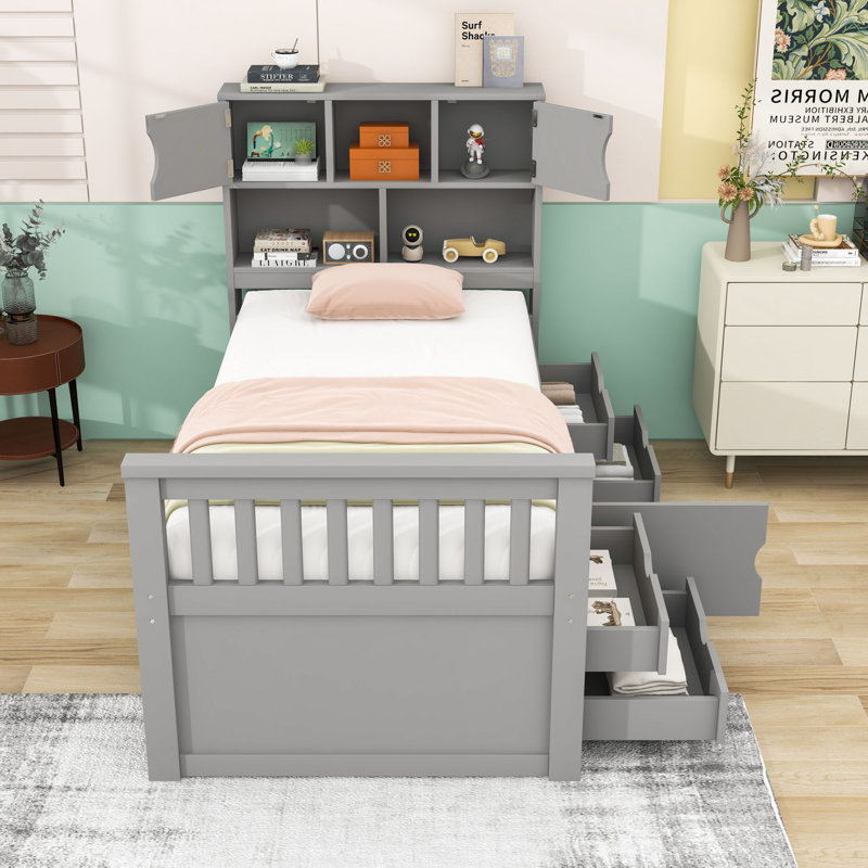 Lit plateforme simple en bois avec quatre tiroirs et tête de lit avec bibliothèques de rangement