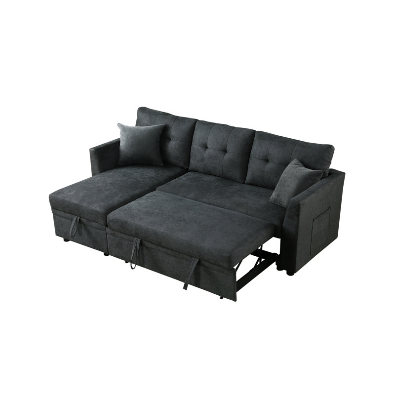 Canapé-lit d'angle en L avec rangement intégré, recouvert de velours gris et s'ouvrant sur un lit gigogne.