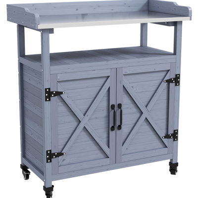 Banc de rempotage extérieur gris. Bois avec compartiment de rangement. Surface de travail en aluminium. Roues en caoutchouc pour un mouvement pratique. Rouille. Pour l'aménagement paysager du patio. Rangement de table l 34,72 po x P 16 po H 37,5 po. Bois et