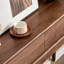 Table console en bois massif brun avec tiroir cannelé et embouts en laiton-131374658