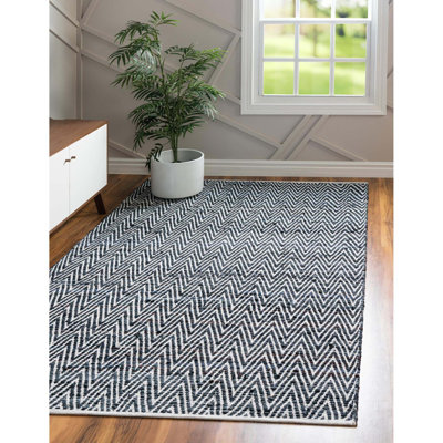 Tapis noir en coton tissé à plat à la main Hareesh
