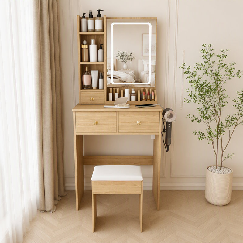 Petit meuble-lavabo moderne avec 3 modes d'éclairage DEL à luminosité réglable, 3 tiroirs et plusieurs tablettes de rangement ouvertes, un support pour sèche-cheveux et une prise de courant, ainsi qu'un fauteuil à langer.