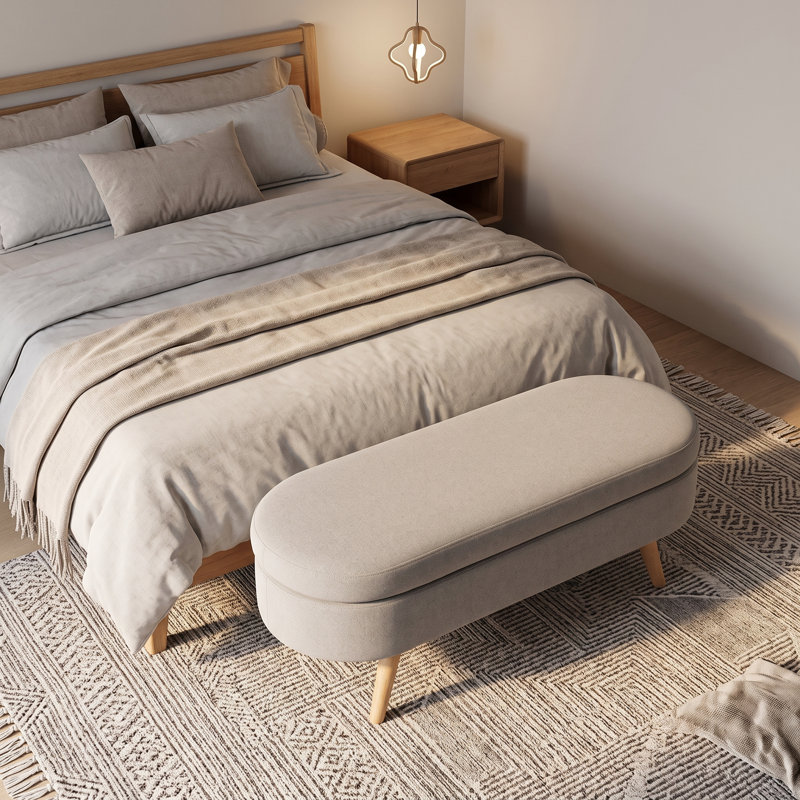 Banc de rangement avec repose-pieds ovale avec revêtement en tissu plissé, pieds en bois d'hévéa et compartiment de rangement caché - repose-pieds polyvalent, sièges supplémentaires et décoration de salon