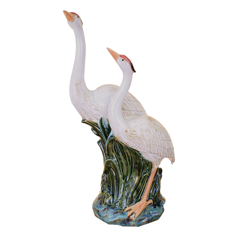Statue herons réfléchissant