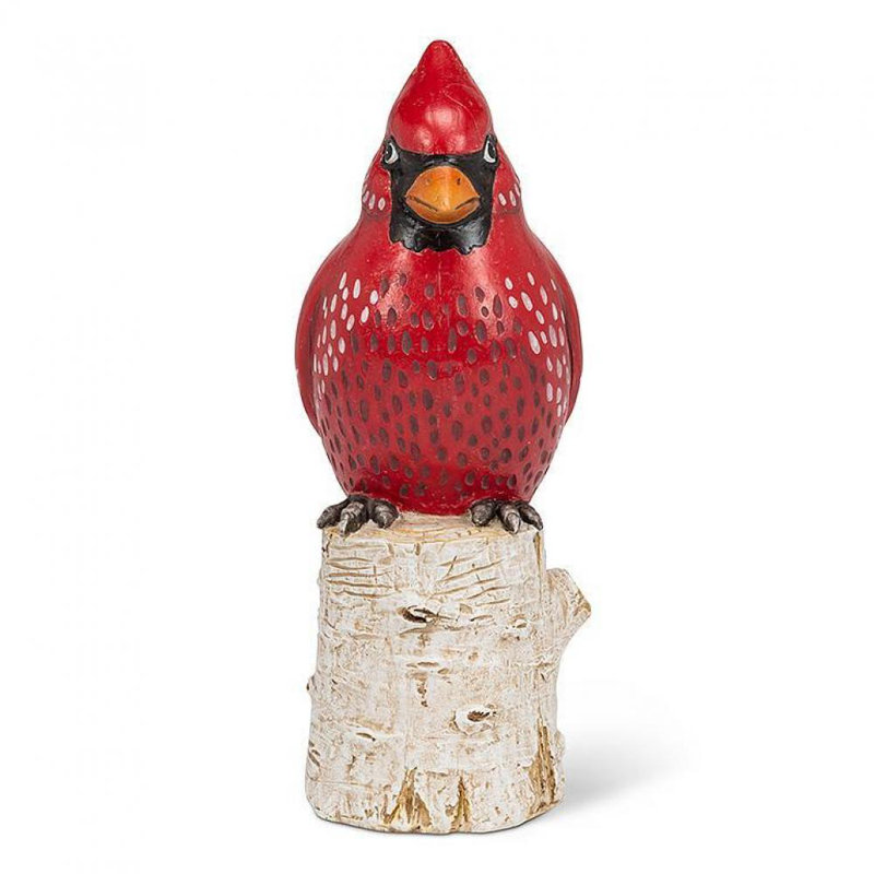 Figurine cardinal sur une souche de bouleau
