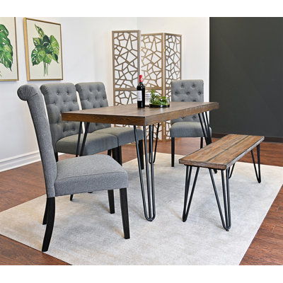 Ensemble de salle à manger 6 pièces avec table en pin rustique, base en métal, chaises rembourrées et banc pour une décoration intérieure élégante