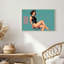 Femme en body noir assise sur un tabouret, toile murale sur fond turquoise-795538829