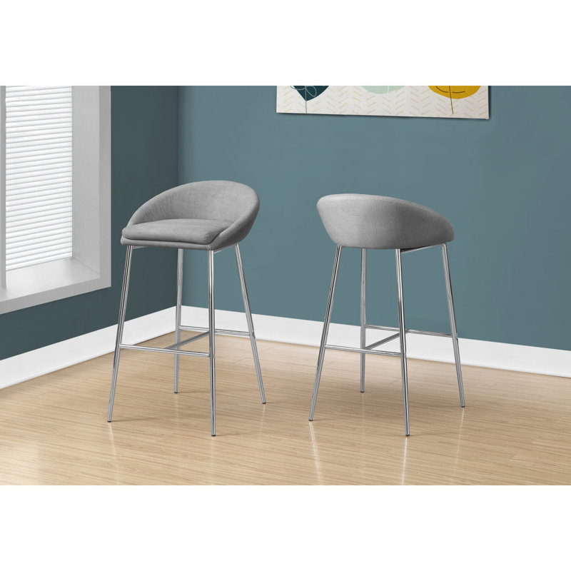 Élégants tabourets de bar en métal et en tissu, ensemble de 2, pour un bar ou un îlot de cuisine contemporain et moderne.
