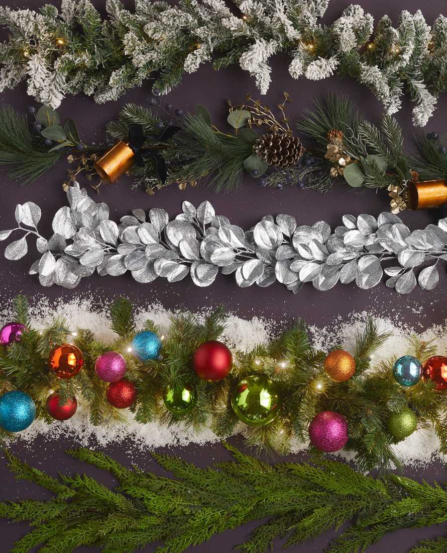 Overhead shot of several different types of holiday garlands.