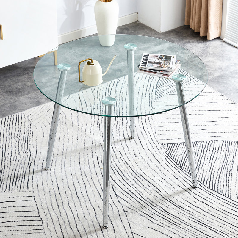 Un plateau de table en verre d'un diamètre de 38,6 pouces et une table de salle à manger circulaire minimaliste moderne avec des pieds en métal argenté. Convient pour les salons et les salles de conférence.