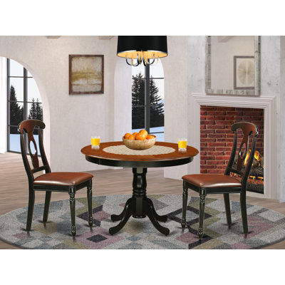 3 Piece Kitchen Table & Chairs Set Contains a Round Dining Room Table with Pedestal and 2 Faux Leather Upholstered Chairs, Black & Cherry