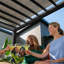 Ensemble de pergola d'extérieur en acier galvanisé 14 pi x 10 pi avec abat-jour et PowerPort Backyard Discovery Trenton